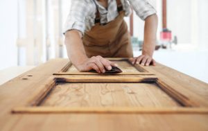 carpenter doing a wood reface to the kitchen cabinets