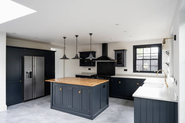 Granite countertops with black accented kitchen cabinets.