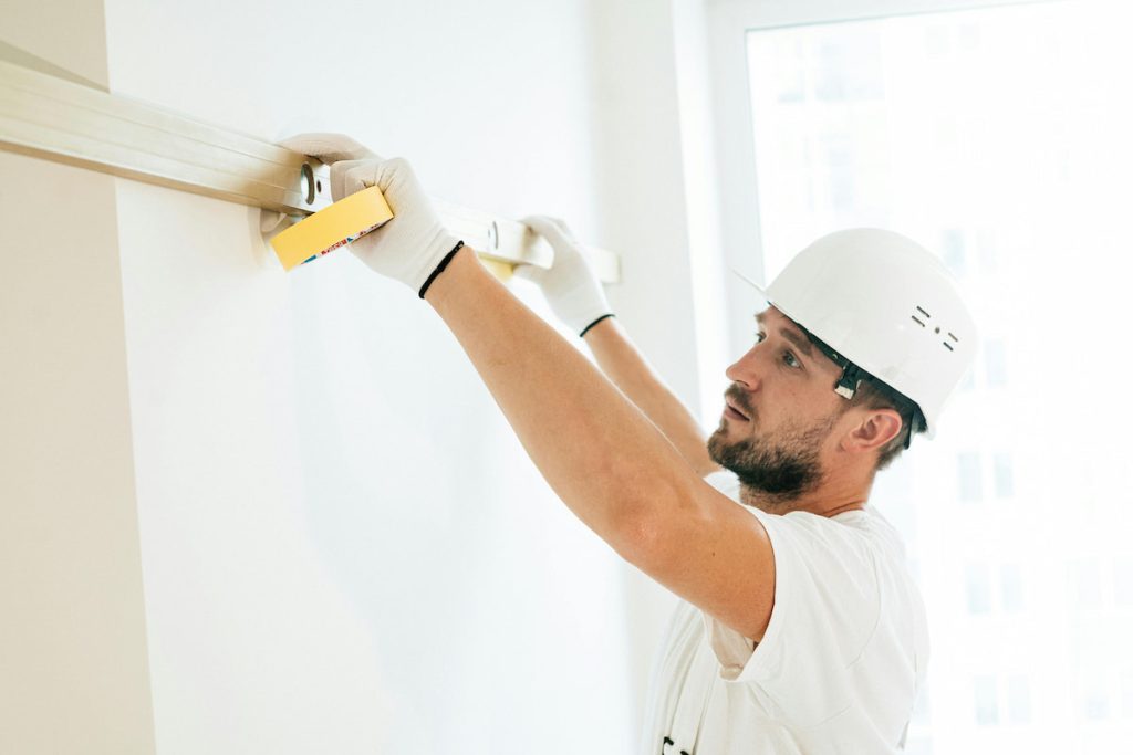 A Man using Spirit Level
